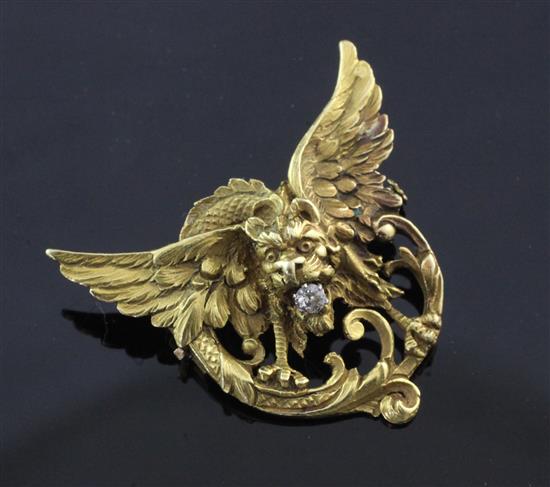 A pierced 18ct gold and diamond winged gargoyle brooch, 1.25in.